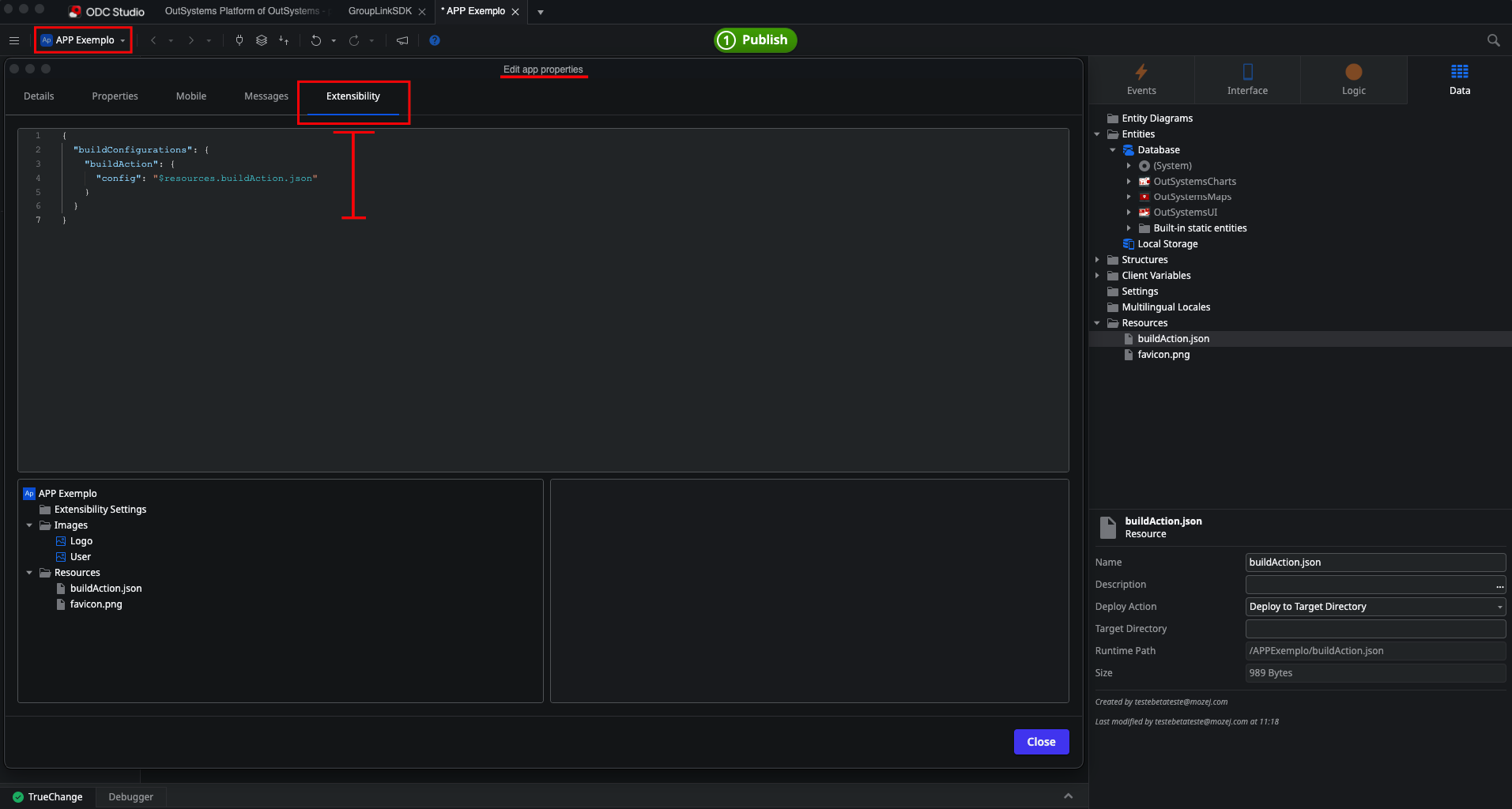Tela do ODC Studio exibindo as propriedades do app, com a aba "Extensibility" selecionada e destacada. O editor mostra um JSON de configuração referenciando o arquivo "buildAction.json" via "$resources.buildAction.json".